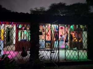 a room with a stained glass window at night at Mad Vervet Nairobi Backpackers Hostel in Nairobi