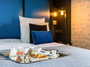 Postel nebo postele na pokoji v ubytování Mercure Figeac Viguier du Roy + 37 fotografií