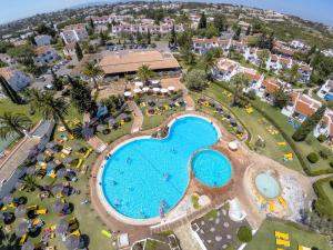 an overhead view of the pool at a resort at Rocha Brava Village Resort in Carvoeiro