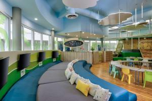 a playroom with a couch that looks like a train at Hilton Cancun Mar Caribe All-Inclusive Resort in Cancún