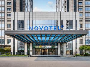 a building with the noventel sign on it at Novotel Shanghai JingAn in Shanghai