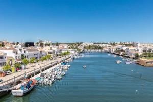 an aerial view of a harbor with boats in the water at NEW!! 1 Bedroom Center Tavira - R. Freiras in Tavira
