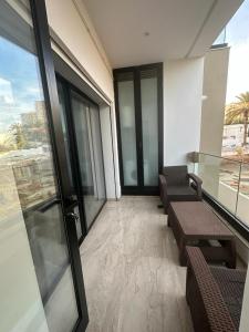 a room with chairs and tables in a building at Luxueux S+2 Menzah5 in Ariana +20 photos