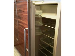 a refrigerator with its door open in a kitchen at With lake and alpine view in Immenstaad am Bodensee
