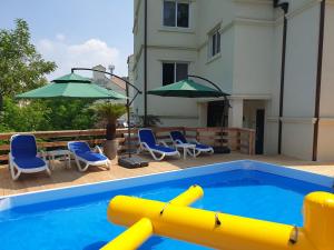 a swimming pool with a yellow inflatable at Park Art Villas in Buyeo