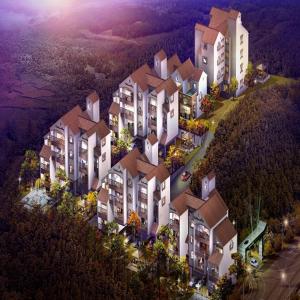 an aerial view of a large building on a hill at Park Art Villas in Buyeo