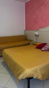 Postel nebo postele na pokoji v ubytování B&B Metropols Sottomarina