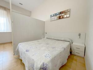 Cama o camas de una habitación en Apartamentos Turisticos Mediterraneo