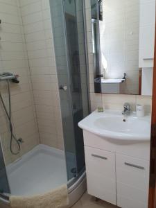 a bathroom with a shower and a sink at Inas Place in Baška Voda +35 photos