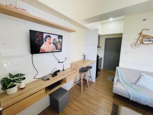 TV a/nebo společenská místnost v ubytování Northwoods Place Condominium