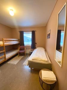 Postel nebo postele na pokoji v ubytování Skoghus