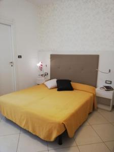 Postel nebo postele na pokoji v ubytování B&B Metropols Sottomarina
