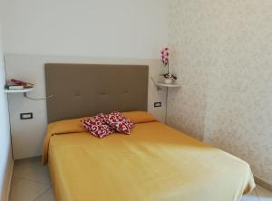 Postel nebo postele na pokoji v ubytování B&B Metropols Sottomarina