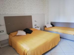 Postel nebo postele na pokoji v ubytování B&B Metropols Sottomarina