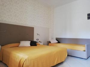 Postel nebo postele na pokoji v ubytování B&B Metropols Sottomarina