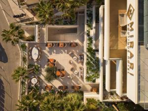 an overhead view of a resort with a pool and palm trees at Mirari Boutique Hotel in Split