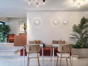 a dining room with two chairs and a table at The Newel Acropolis in Athens