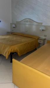 Postel nebo postele na pokoji v ubytování B&B Metropols Sottomarina