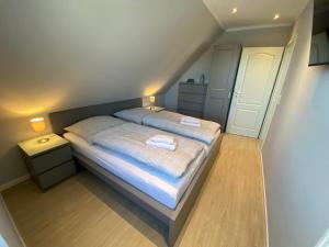 Ένα ή περισσότερα κρεβάτια σε δωμάτιο στο Jona