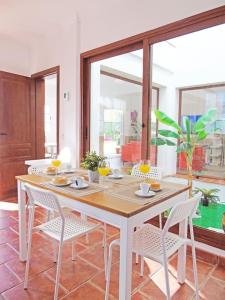 a dining room with a table and chairs at Luxurious villa with private pool - Villa Jardín in Santa Cruz de Tenerife