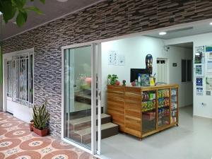 a store front with a brick wall at Hotel vacation Doradal in Doradal