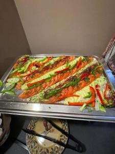 a tray of food with vegetables on a table at Good Spot Zieleniec Twin Eco 04 in Duszniki Zdrój