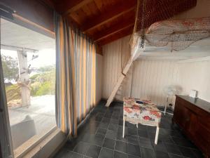 a small room with a table and a window at Repubblica delle pergole in Realmonte