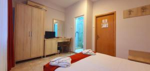 Postel nebo postele na pokoji v ubytování OITUZ Boutique Residence