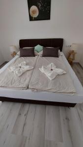 Postel nebo postele na pokoji v ubytování Pitypang Apartman