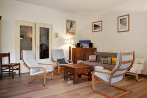 a living room with chairs and a couch at Chalet de 6 chambres avec vue sur la ville balcon et wifi a Briancon a 1 km des pistes in Briançon