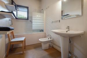 a bathroom with a sink and a toilet at Chalet de 6 chambres avec vue sur la ville balcon et wifi a Briancon a 1 km des pistes in Briançon