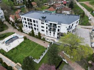 an aerial view of a large white building with a yard at Hedonica 2 New Apartment in Vrdnik