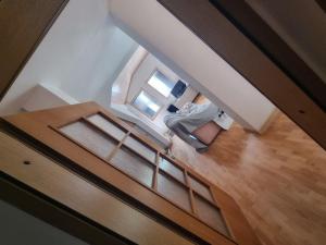 an overhead view of a woman sitting in a chair in a room at Luxury Apartment with parking space in Vodno