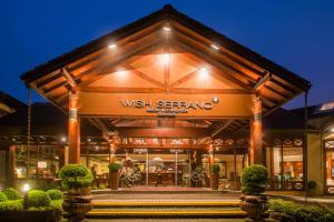 a building with a sign that reads west serenarma at Wish Serrano Resort in Gramado