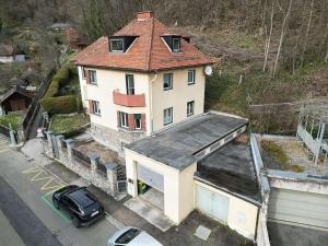 a house with a car parked in front of it at Appartement Huber - TOP1 in Bruck an der Mur