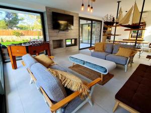 a living room with a couch and a table at Mitjana's House in Cala Galdana