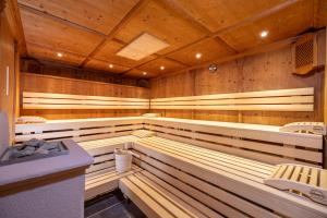an empty sauna with wooden walls and ceilings at Der Rindererhof in Tux