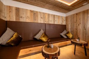 a living room with a couch and a table at Der Rindererhof in Tux