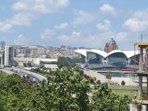 a view of a city with a stadium and buildings at Venera Hotel in Baku