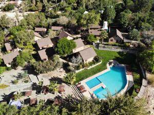 an aerial view of a house with a swimming pool at Cabañas Las Gredas SPA Pisco Elqui in Pisco Elqui