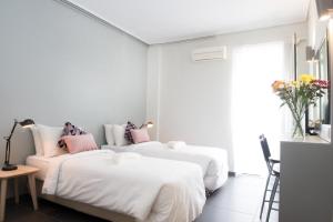 Ein Bett oder Betten in einem Zimmer der Unterkunft Athens Studios