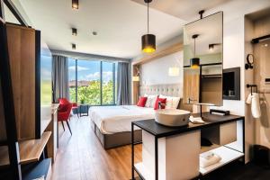 a hotel room with a bed and a desk at Up Hotel Budapest in Budapest