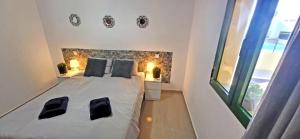 Postel nebo postele na pokoji v ubytování Ferienwohnung Calma + 14 fotografií