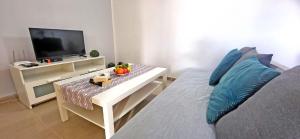 TV a/nebo společenská místnost v ubytování Ferienwohnung Calma