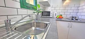 Kuchyň nebo kuchyňský kout v ubytování Ferienwohnung Calma