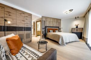 Łóżko lub łóżka w pokoju w obiekcie Das Central – Alpine . Luxury . Life