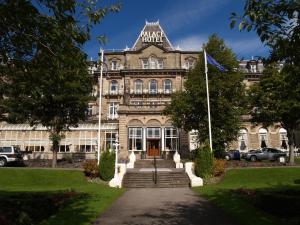 a large building with a flag in front of it at Palace Hotel & Spa Buxton in Buxton +104 photos