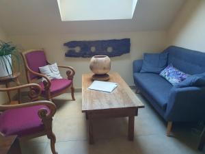 Posezení v ubytování chambre d'hôtes de charme, un temps en forêt