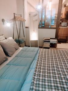 a bedroom with a bed with a rug on the floor at 4U SuperCentral,seaside,cosy family apartment in Thessaloniki