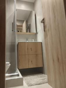 a bathroom with a shower and a sink and a toilet at 4U SuperCentral,seaside,cosy family apartment in Thessaloniki